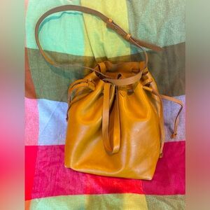 Maxwell transport leather bucket drawstring handle crossbody bag camel/cashew